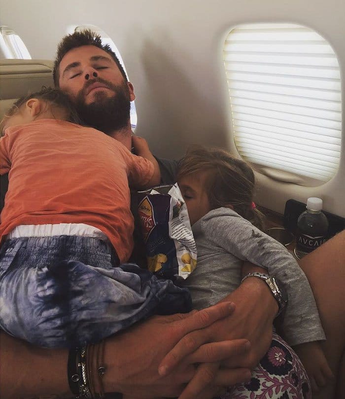 chris hemsworth best dad sleeping in papas arms