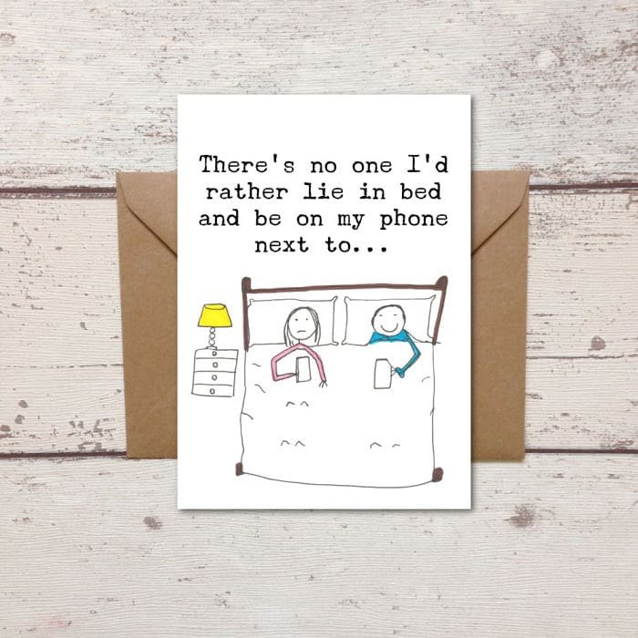 honest-valentines-day-love-cards-be on phone next to