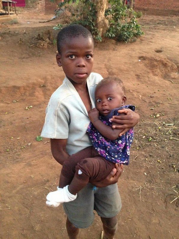 child hold baby