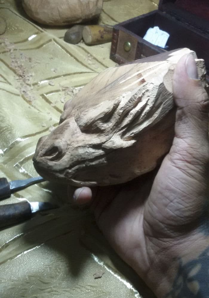 hand carved being carved