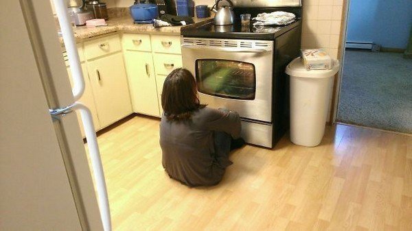 mom sitting oven