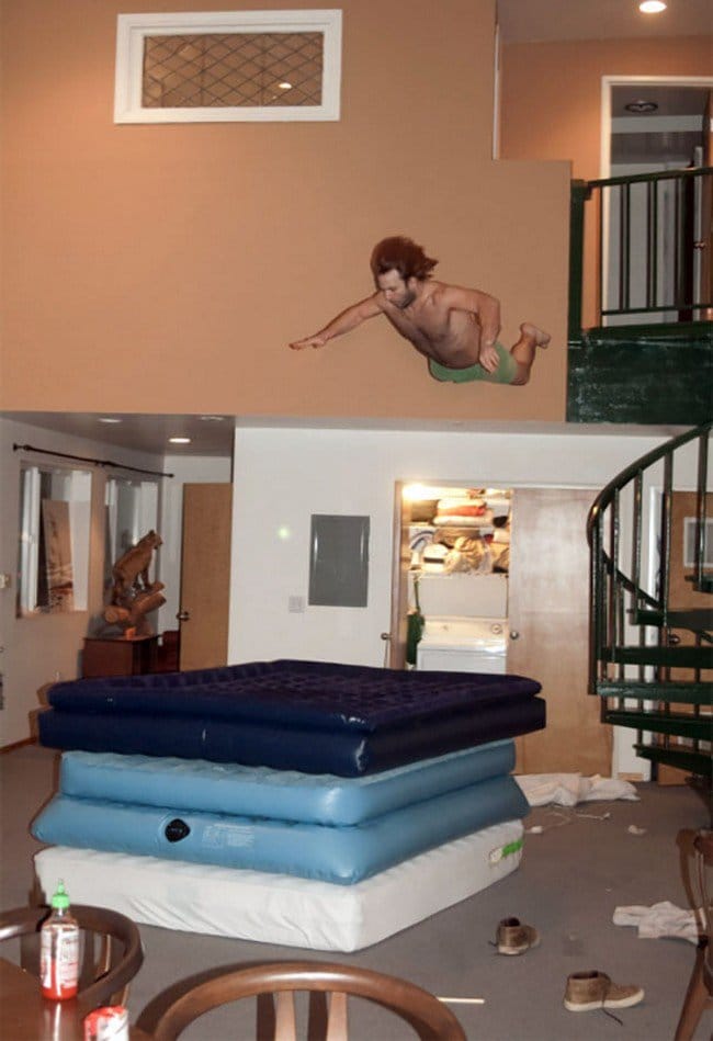 safety fails man jumping mattresses