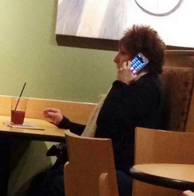 woman using phone wrongly