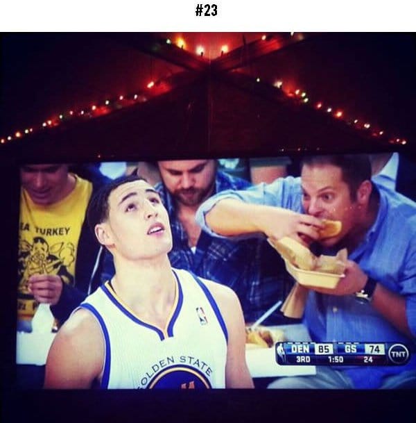 awkward sports moments guy eating food in background