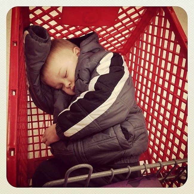 kids sleeping weird places shopping cart