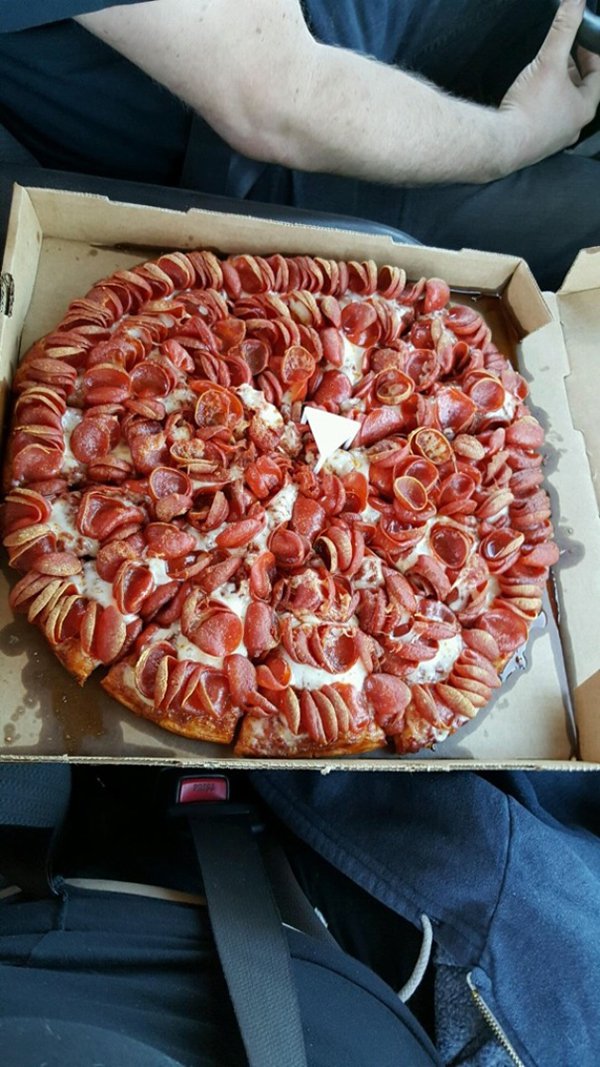 pizza covered in pepperoni