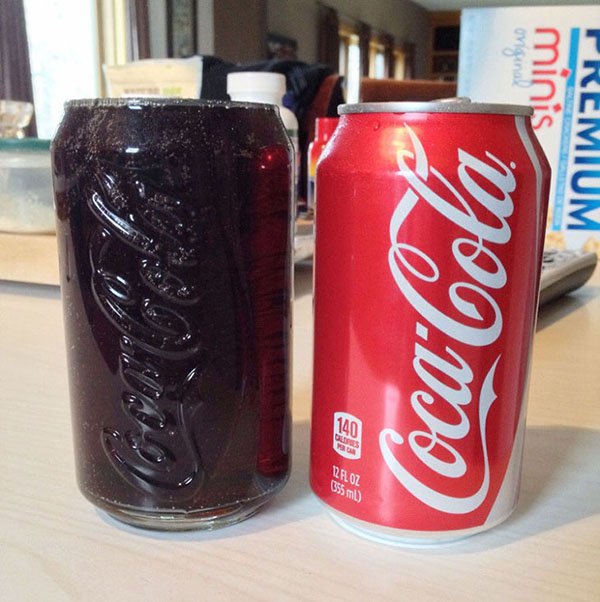 coke can filling up coke glass perfectly