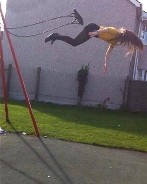 girl falling off of swing