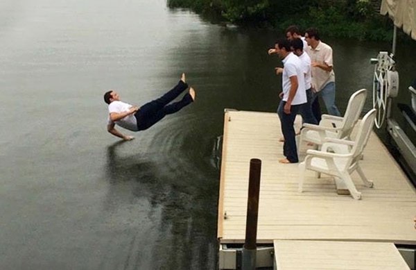 guy about to fall in lake