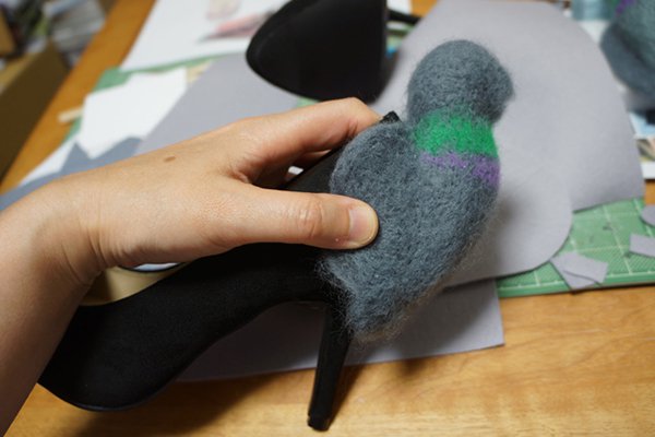 pigeon being attached to shoe