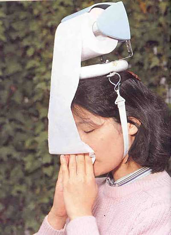 toilet roll attached to head