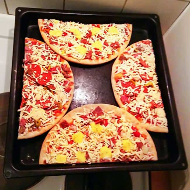Ingenious Life Hacks pizzas cut in half on tray