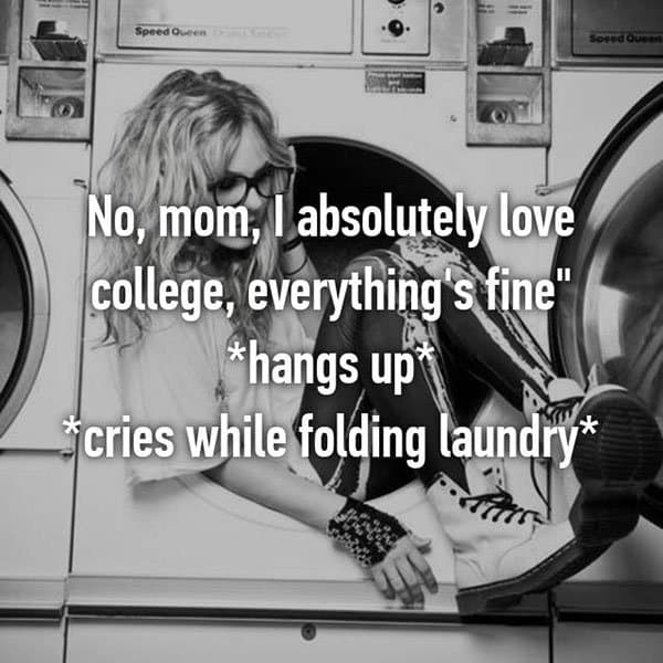 College Student Things cries while folding laundry