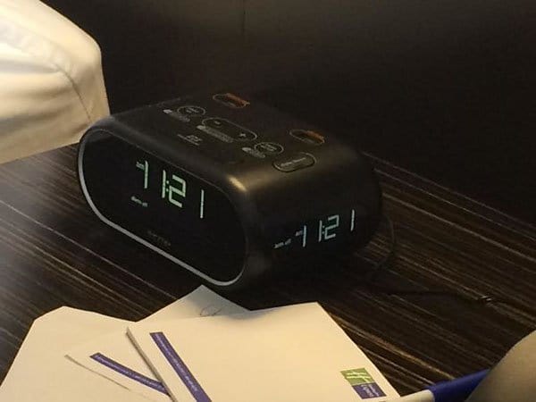 Genius Hotels clock with 3 faces