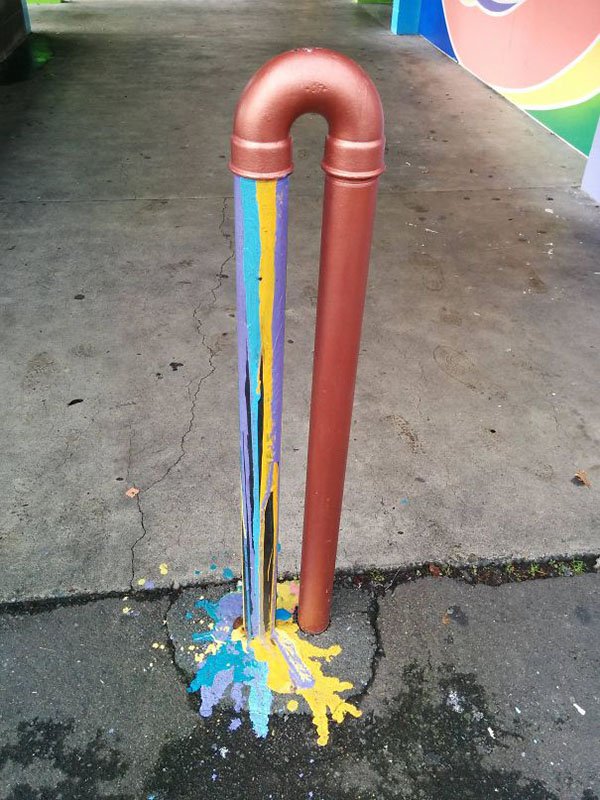 Genius Vandalism creative painting on barrier bars