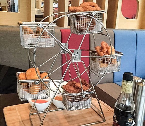 Hipster Restaurants Went Too Far With Food Serving fish and chips served on a ferris wheel