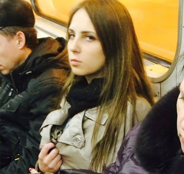 Weirdest People Ever Spotted On The Subway girl with kitten under coat