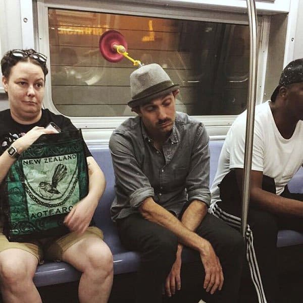 Weirdest People Ever Spotted On The Subway plunger hat