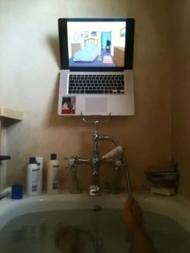 Clever Life Hacks laptop balanced on shower