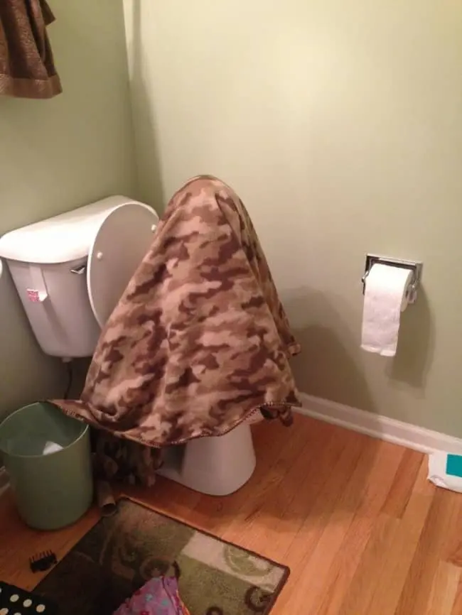 Kids Being Strange blanket on toilet