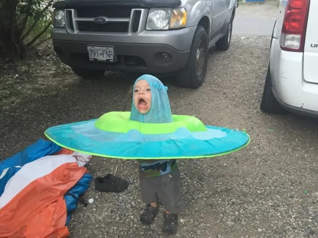 Kids Being Strange child with raft on head