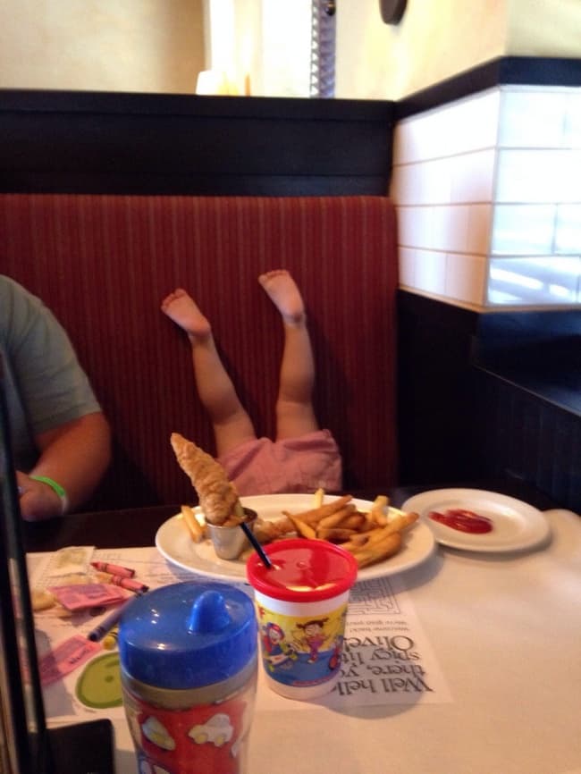 Kids Being Strange upside down at dinner