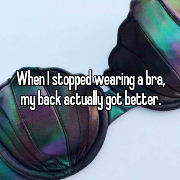Woman showing relief from back pain after stopping wearing a bra