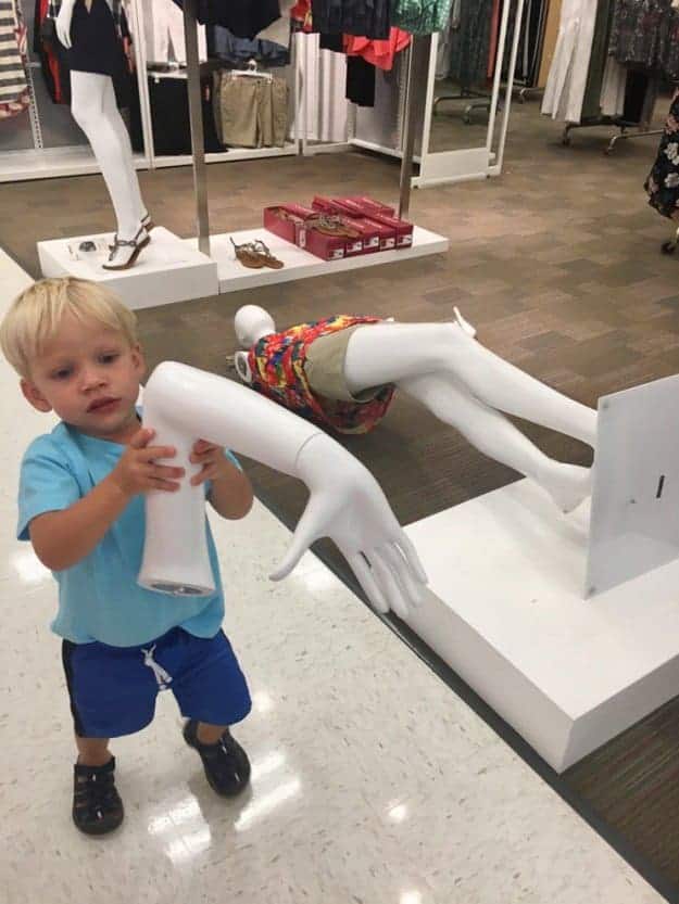 boy-holding-a-mannequins-hand