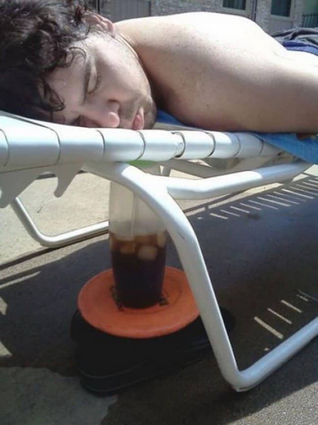drinking_soda_while_lying_down_on_a_lounge_chair