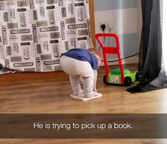 trying_to_pick_up_a_book_kids_crying