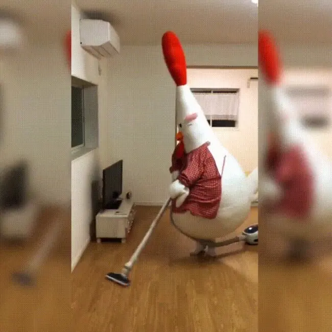 chicken-mascot-vacuums-floor