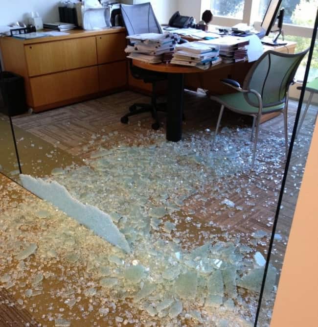 crashing-through-glass-wall-in-the-office-miserable-people