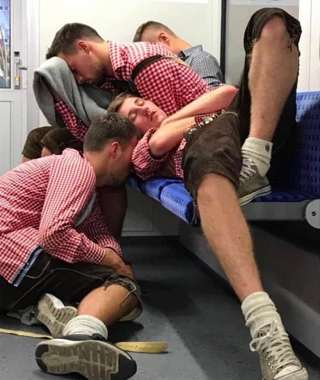 drunk-men-in-matching-clothes-sleeping-on-a-train