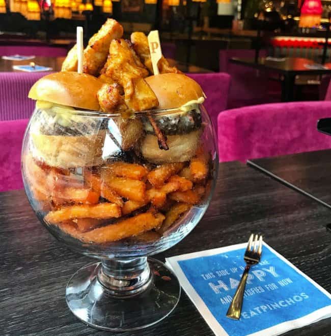 glass-filled-with-burgers-and-fries