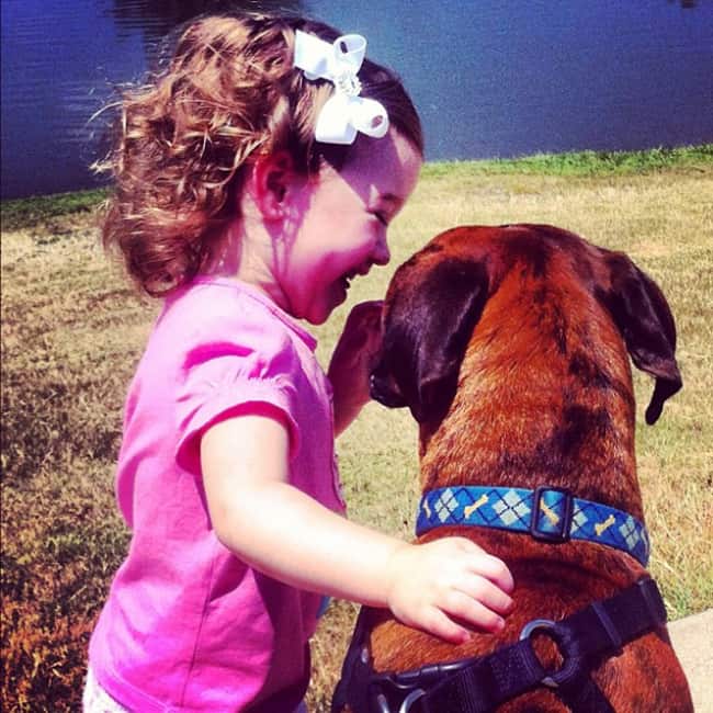 kid-sharing-secrets-with-pet-adorable-photos