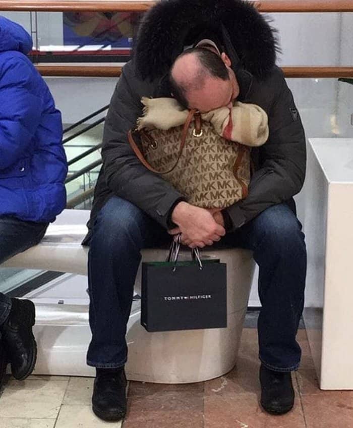 man-falling-asleep-while-waiting-for-girlfriend-men-hate-shopping