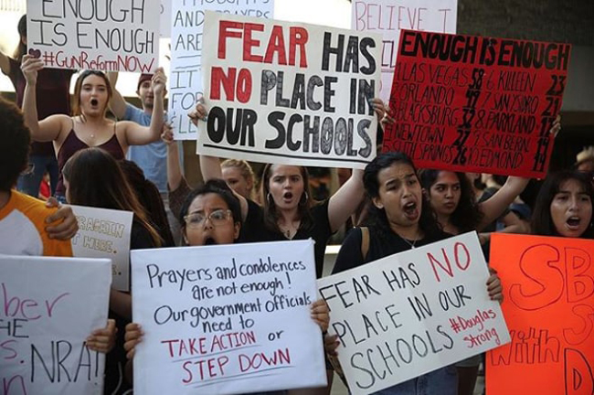 people-rally-against-school-shootings-how-doorstops-can-save-lives