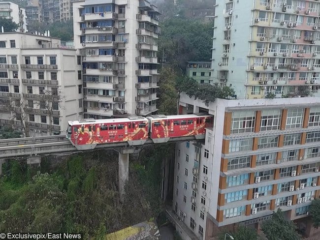train-goes-through-occupied-building-rare-things-pictures