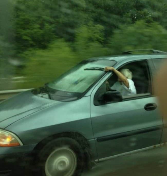 woman-manually-using-the-wiper-of-her-car