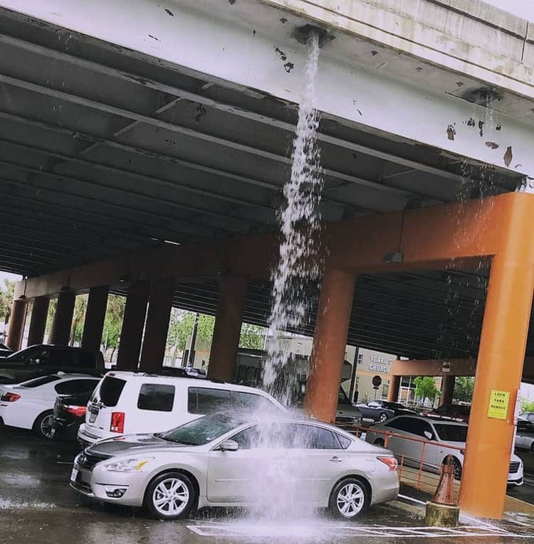 car-shower-from-rainwater-gutter-outrageous-photos