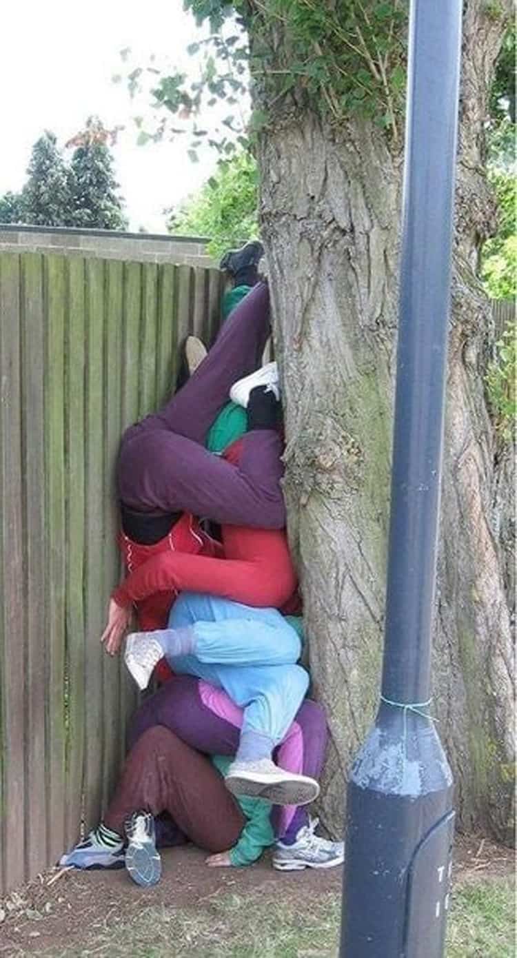 friends-trying-to-get-over-fence-stuck-april-fools