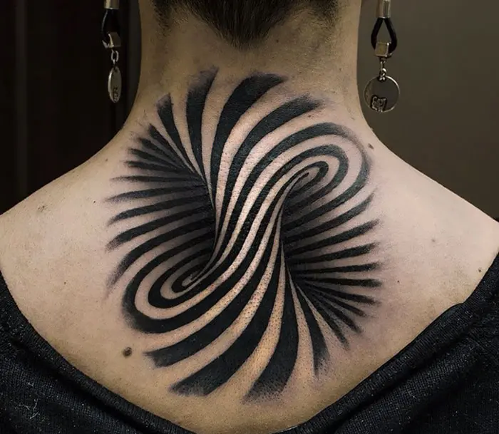 Tattoo Artist Uses Optical Illusions to Reveal a World Beneath the Skin