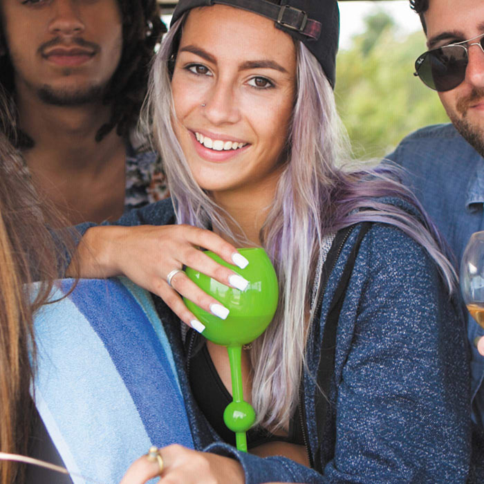 girl holding green wine glass