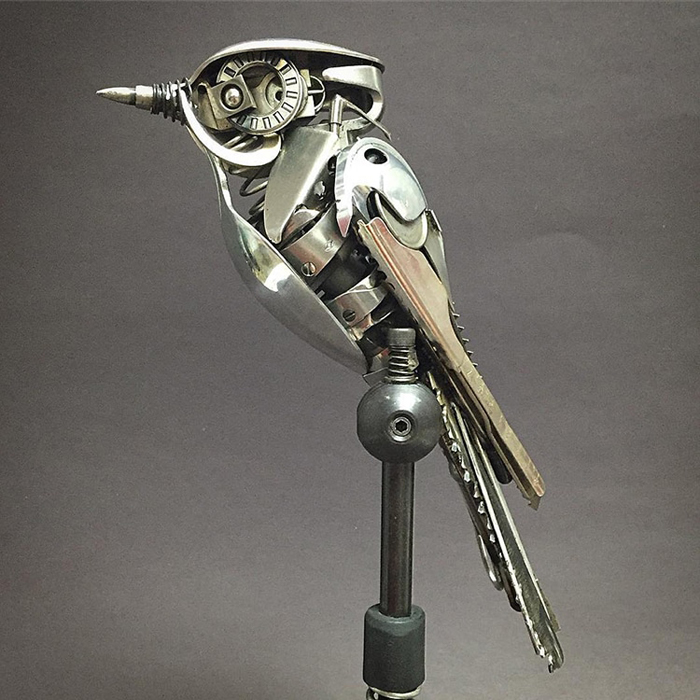 metal bird sculpture intricate detail