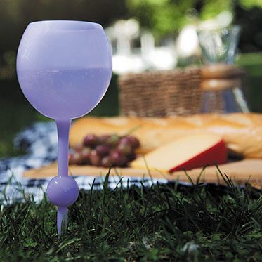 purple wine glass in the grass