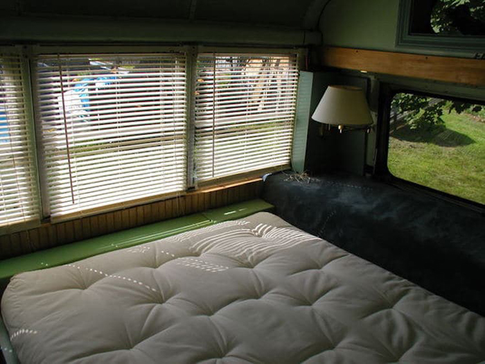 school bus conversion comfy bedroom