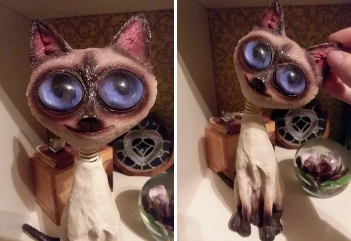 cat figurine big creepy eyes