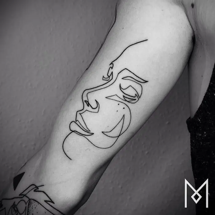 minimalist tattoo woman face