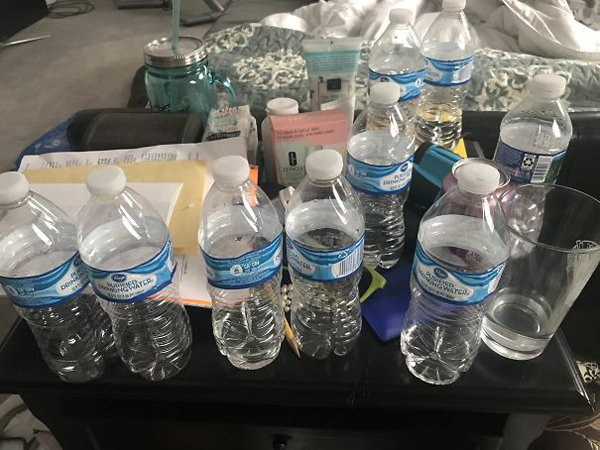 monster roommate empty water bottles nightstand