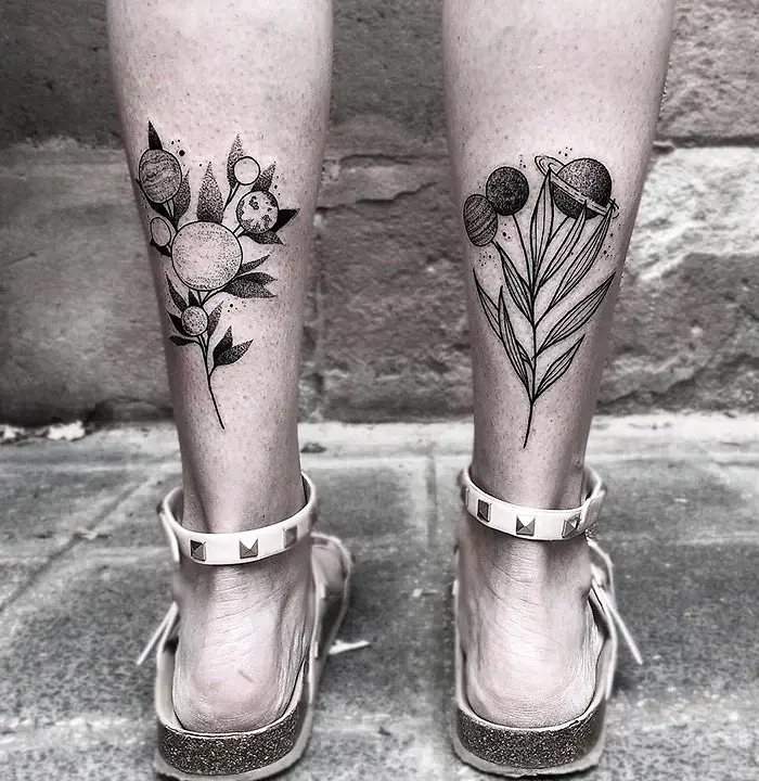 leg tattoos planet flowers